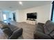 Bright and airy living room with hardwood floors, a flat screen TV, and comfortable seating at 516 Ingleside Ln, Haines City, FL 33844