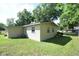 Spacious backyard with a well-maintained lawn, partial fencing, and plenty of room for outdoor activities at 520 Oakland Rd, Auburndale, FL 33823