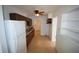 Functional kitchen with wood cabinets, laminate countertops, and an adjacent pantry at 520 Oakland Rd, Auburndale, FL 33823