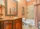 Elegant bathroom featuring a vanity with ornate detailing, bathtub, and decorative accents at 5200 Pebble Beach Blvd, Winter Haven, FL 33884