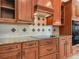 Modern kitchen with stainless steel appliances, granite countertops, and custom cabinets at 5200 Pebble Beach Blvd, Winter Haven, FL 33884