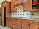 Well-equipped kitchen with sleek appliances, custom cabinets, and decorative backsplash at 5200 Pebble Beach Blvd, Winter Haven, FL 33884