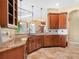 Well-appointed kitchen with granite countertops, custom cabinetry, and a tile backsplash for added style at 5200 Pebble Beach Blvd, Winter Haven, FL 33884