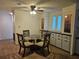 Cozy dining room featuring a round glass table and a built-in cabinet at 6685 Briarhill Dr Ne, Winter Haven, FL 33881