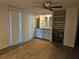 Inviting living area with built-in shelving, storage cabinets, and sliding glass doors at 6685 Briarhill Dr Ne, Winter Haven, FL 33881