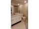 Bathroom featuring a white vanity, toilet and a tile enclosed walk-in shower at 7201 Country Club Dr # G21, Lake Wales, FL 33898