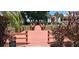 View of community boardwalk surrounded by colorful plants and lush landscaping at 7201 Country Club Dr # G21, Lake Wales, FL 33898