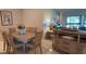 Well-lit dining space with classic furniture, neutral walls, and stylish accents at 7201 Country Club Dr # G21, Lake Wales, FL 33898
