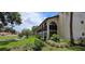 Condo building with a lake view and lovely landscaping at 7201 Country Club Dr # G21, Lake Wales, FL 33898