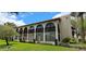 Condo building with a lake view and arched windows at 7201 Country Club Dr # G21, Lake Wales, FL 33898