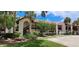 Condominium building featuring lush landscaping, a red tile roof, and a private stairwell at 7201 Country Club Dr # G21, Lake Wales, FL 33898
