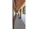 Condo hallway with a pebble floor and wooden ceiling at 7201 Country Club Dr # G21, Lake Wales, FL 33898