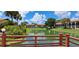 Scenic lake view from community boardwalk, surrounded by villas and verdant landscaping at 7201 Country Club Dr # G21, Lake Wales, FL 33898