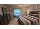 Spacious main bedroom featuring sliding glass doors, a dresser, and ample natural light at 7201 Country Club Dr # G21, Lake Wales, FL 33898