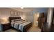 Comfortable main bedroom boasts soft lighting, carpet flooring, and a peaceful ambiance at 7201 Country Club Dr # G21, Lake Wales, FL 33898