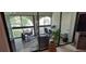 Bright sunroom featuring tile flooring, work spaces and sliding glass doors at 7201 Country Club Dr # G21, Lake Wales, FL 33898