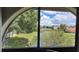 View of the property with a lagoon, dock and neighboring houses beyond at 7201 Country Club Dr # G21, Lake Wales, FL 33898