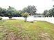 Large backyard with a privacy fence and a storage shed at 7814 Plunkett Ave, Orlando, FL 32810
