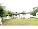 Inviting home exterior with a covered porch and a neatly fenced yard at 7814 Plunkett Ave, Orlando, FL 32810