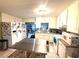 Bright kitchen featuring white cabinetry, granite countertops, and stainless steel appliances at 7814 Plunkett Ave, Orlando, FL 32810