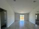 Bright and spacious living room with tile floors and sliding glass doors leading to the backyard at 2137 Emma Ln, Lake Wales, FL 33859