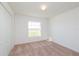 Cozy bedroom featuring a large window providing plenty of natural light and a closet for storage at 2173 Emma Ln, Lake Wales, FL 33859