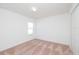 A bright, carpeted bedroom features a double-door closet and a window at 2173 Emma Ln, Lake Wales, FL 33859