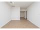 Spacious living room showcasing light tile flooring and a view into the entryway at 2173 Emma Ln, Lake Wales, FL 33859