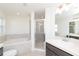 Bathroom features a shower, garden tub, and double vanity at 322 Brennan Ave, Frostproof, FL 33843