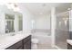 Bathroom boasts a soaking tub, shower, and double vanity at 322 Brennan Ave, Frostproof, FL 33843