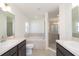 Double vanity bathroom with a shower and garden tub at 322 Brennan Ave, Frostproof, FL 33843