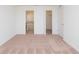 Bright bedroom with carpeting, ensuite bath, and walk-in closet at 322 Brennan Ave, Frostproof, FL 33843