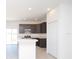 Modern kitchen with stainless steel appliances and an island at 322 Brennan Ave, Frostproof, FL 33843
