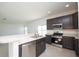 Modern kitchen with stainless steel appliances and an island at 322 Brennan Ave, Frostproof, FL 33843