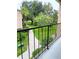 Balcony view of winding sidewalk, lush landscaping, and trees at 1019 Grove St # 85, Maitland, FL 32751