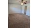Spacious bedroom with neutral walls, carpet, ceiling fan, and a closet at 1019 Grove St # 85, Maitland, FL 32751