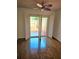 Bedroom with sliding glass door to balcony and shuttered window at 1019 Grove St # 85, Maitland, FL 32751