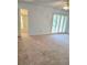Bedroom with carpet, fan, and sliding glass door to balcony at 1019 Grove St # 85, Maitland, FL 32751