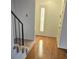 Hallway with stairs, wood floors, and decorative shuttered window at 1019 Grove St # 85, Maitland, FL 32751