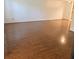 Spacious living room with gleaming wood floors at 1019 Grove St # 85, Maitland, FL 32751