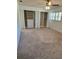 Spacious bedroom with a ceiling fan, neutral carpet, a window, and open closets with storage at 1019 Grove St # 85, Maitland, FL 32751