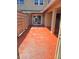 Spacious outdoor patio with stained concrete, privacy fence, secure door, and sliding glass door at 1019 Grove St # 85, Maitland, FL 32751