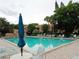 Large community pool with aqua water and a pool deck with lounge chairs at 1019 Grove St # 85, Maitland, FL 32751
