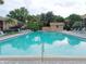 Large community pool with lounge chairs and lush landscaping at this charming residential property at 1019 Grove St # 85, Maitland, FL 32751