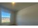 Cozy bedroom with plush carpet and a large window offering abundant natural light at 216 Harper Estates Cir, Lake Wales, FL 33859