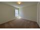 Bedroom with neutral carpet and fresh paint is illuminated by natural light at 221 Harper Estates Cir, Lake Wales, FL 33859