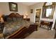 The main bedroom includes an ensuite bathroom, a large bed and decorative mirror above the bureau at 5002 Tideview Cir # 3, Orlando, FL 32819