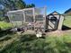 View of chicken coop and chickens with attached shed on a sunny day at 1004 Country Oaks Ln, Lakeland, FL 33810