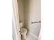 Small half bathroom with toilet and grab bar at 1159 Greenley Ave, Groveland, FL 34736