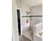 Large bathroom with walk-in shower and marble tile at 1159 Greenley Ave, Groveland, FL 34736